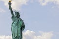 Close up view of Statue of Liberty against backdrop of white clouds. New York. Royalty Free Stock Photo