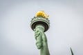 Close Up View Of Statue Of Liberty Torch Enlightening The World With A Golden Flame In Manhattan, New York City, NY, USA