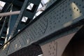 Close up view of steel bridge structure with visible bolts and rivets, strength and engineering behind design. Industrial and Royalty Free Stock Photo