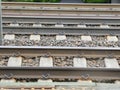 Close up view of steel railroad tracks on a gravel bed with concrete ties Royalty Free Stock Photo