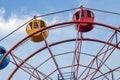 Close up view of a stopped ferris wheel under the clean blue sky Royalty Free Stock Photo