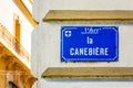 Close-up view of the street name sign of La Canebiere in Marseille, France