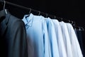 close-up view of stylish male shirts on hangers Royalty Free Stock Photo