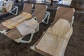 Close-up view of sun loungers with wet towels near outdoor pool in hotel. Royalty Free Stock Photo