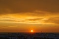 Close-up view of the sunset and clouds illuminated by the setting sun.