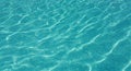 Close-up of rippling turquoise swimming pool water with sunlight reflections blue clear Royalty Free Stock Photo