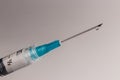 Close up view of a syringe with hypodermic needle and a droplet of fluid. Opiate and heroin overdoses have skyrocketed recently IV Royalty Free Stock Photo