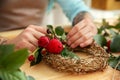 Close up view of tattooed florist preparing flower