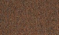 close-up view textured brown fabric, possibly carpet or textile, with repeating pattern small vertical lines. Royalty Free Stock Photo