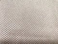 Close-Up View of a Textured Fabric Surface. Detailed texture of woven material with a geometric pattern. Brown Royalty Free Stock Photo