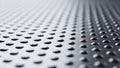 A close-up view of a textured metal surface with raised dots Royalty Free Stock Photo