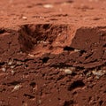 Close-up view of a textured red clay surface, exhibiting a compact and rugged Royalty Free Stock Photo