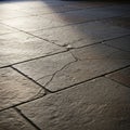 A close-up view of a textured stone floor with rectangular tiles Royalty Free Stock Photo