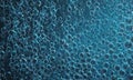 close-up view textured surface with numerous small bubbles in shades blue and black, creating visually Royalty Free Stock Photo