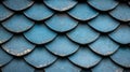 A close-up view of a textured surface with a repeating pattern of overlapping, curved shapes in shades of blue and gold. Royalty Free Stock Photo