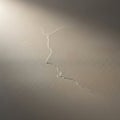 Close-up view of a textured surface with a subtle, meandering crack. The lighting creates gentle Royalty Free Stock Photo