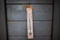 Close-up view of thermometer on wooden wall
