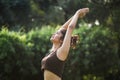 Selective Focus On Thin Beautiful Woman Performing Surya Namaskar Exercise In Park