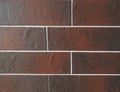 Close Up view of tile brick ceramic granite panels made in the color of brown. Fragment of the surface of the wall. can be used as