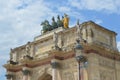 Close up view to statues on Arc de Triomphe du Carrousel in Place du Carrouse yard Royalty Free Stock Photo