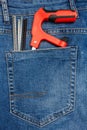 Close Up View to Working Tools Sticking Out From a Blue Jeans Pocket Royalty Free Stock Photo