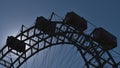 Close-up view of the top of a big Ferris wheel in park Wurstelprater in Vienna, Austria with backlight. Royalty Free Stock Photo