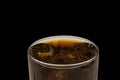 Close up view of top of full glass of soda with ice cubes isolated on black background. Unhealthy drinks concept. Royalty Free Stock Photo