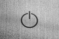 Close up view of touch power button on metallic surface