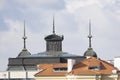 Close-up view of towers and roof tiles of city buildings