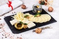 Close up view on traditional Georgian served assorted cheeses with honey and nuts. Royalty Free Stock Photo