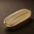 A close-up view of a translucent, oval-shaped object resembling a grain of rice. It rests Royalty Free Stock Photo