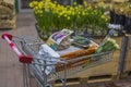 Close up view of trolley in store with purchased gardening supplies.