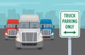 Close-up view of a `Truck parking only` sign. American trucks parked parked in rest area. Front view.