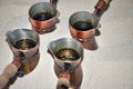 Close up view of turkish coffee prepared on hot golden sand. Royalty Free Stock Photo