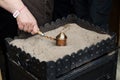 Close up view of turkish coffee prepared on hot golden sand. Coffee preparation concept