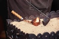 Close up view of turkish coffee prepared on hot golden sand. Coffee preparation concept Royalty Free Stock Photo