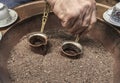 Close up view of turkish coffee prepared on hot golden sand. Royalty Free Stock Photo
