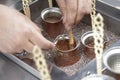 Close up view of turkish coffee prepared on hot golden sand Royalty Free Stock Photo