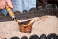 Close up view of turkish coffee prepared on hot sand Royalty Free Stock Photo