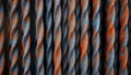 Close-up view of twisted steel bars. Rusty orange, gray metal texture. Strong, durable construction material. Parallel lines