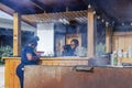 Close-up view of two African American waiters at an open-air barbecue restaurant. Royalty Free Stock Photo