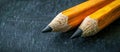 Two Pencils Close Up on Black Surface Royalty Free Stock Photo