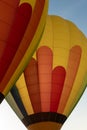 Close-up view of two hot air balloons in green, blue, red  and yellow colors Royalty Free Stock Photo