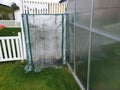 Close up view of two kind of greenhouses on backyard. Gardening concept