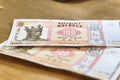 Moldovan 100 Leu Banknotes on Wooden Surface Royalty Free Stock Photo