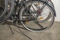 Close up view of two parked bicycles and one of them with flat tire.