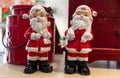 Close up view of two porcelain Santa Claus Dolls on a wooden table Royalty Free Stock Photo