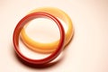 Close up view of two vintage bakelite bangle bracelets on white background Royalty Free Stock Photo