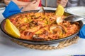 Close up view of typical Spanish paella ready to serve in restaurant