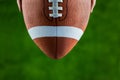 Close up view of upheld football Royalty Free Stock Photo